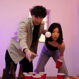 young-adults-playing-beer-pong_23-2149402834